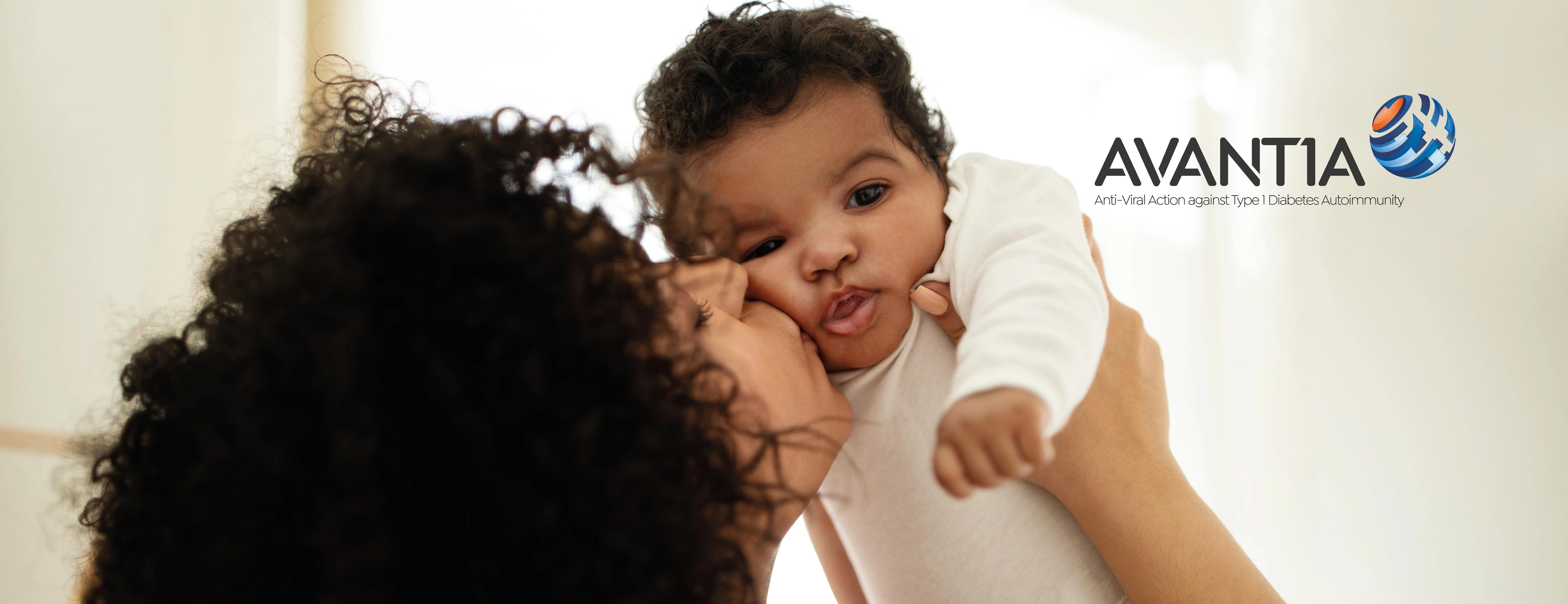 Alias - Happy millennial african american mother kissing little child, enjoy relax together, have fun in bedroom interior