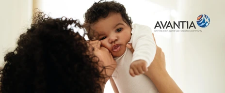 Alias - Happy millennial african american mother kissing little child, enjoy relax together, have fun in bedroom interior