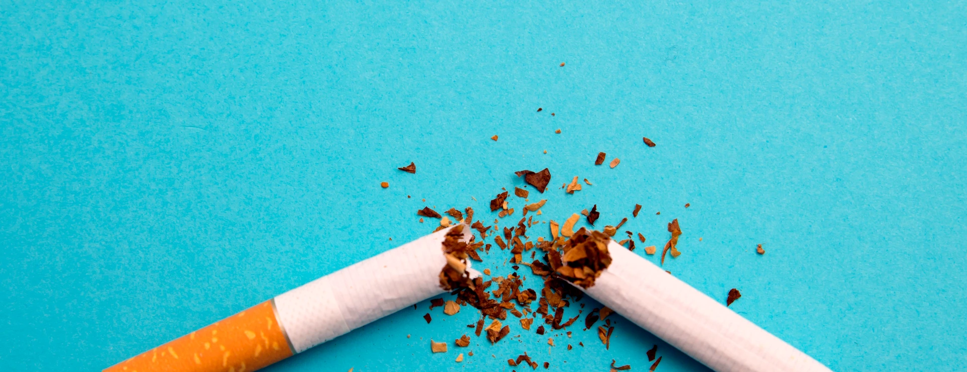broken cigarette on a blue background