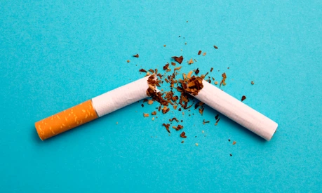 broken cigarette on a blue background