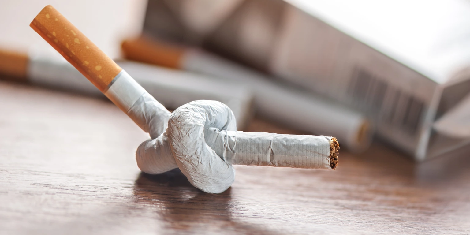 tied cigarette on table closeup