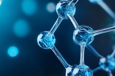 3D representation of insulin protein structure illuminated with a blue glow on a black background_AdobeStock_1073210391