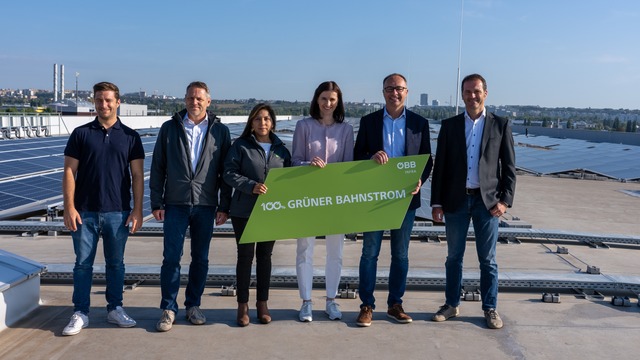 The ÖBB Team in front of a rofftop PV Plant