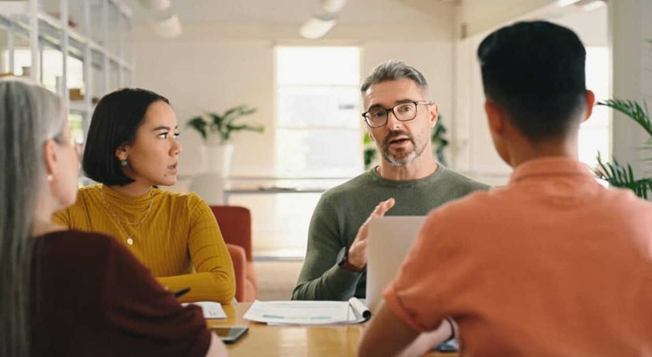 Strategy, CEO or business people in meeting planning a creative startup project in collaboration together. Teamwork, brainstorming or workers with paperwork for our vision, group ideas or sales goals