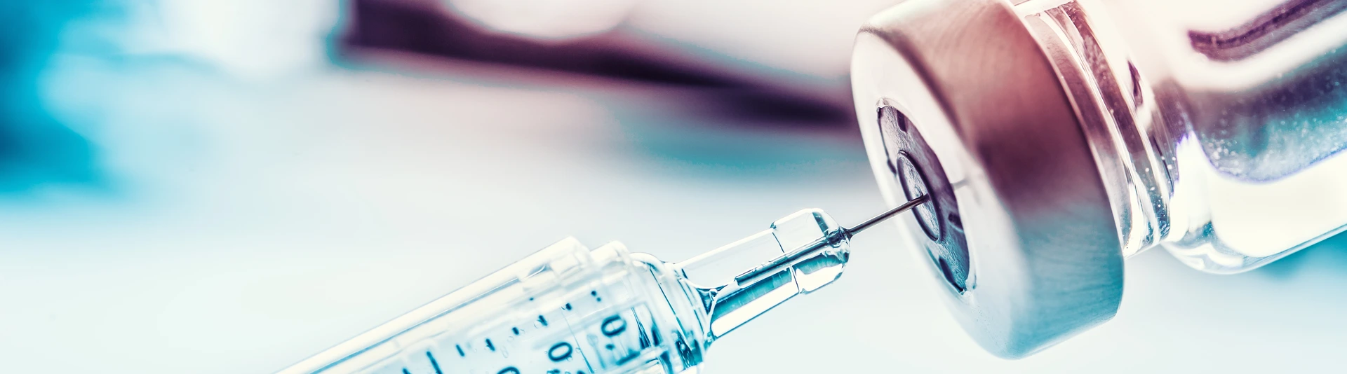 Close-up medical syringe with a vaccine.