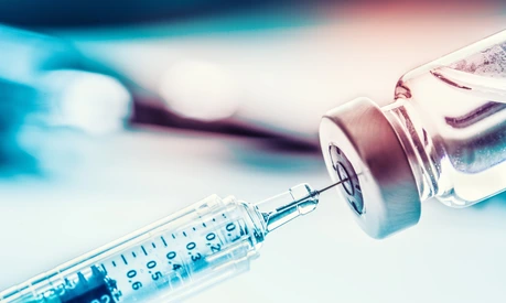 Close-up medical syringe with a vaccine.