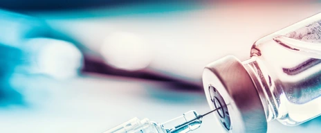 Close-up medical syringe with a vaccine.