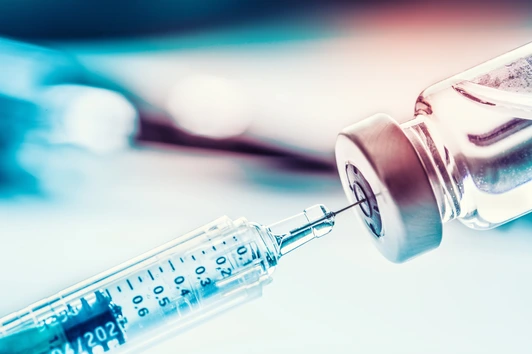 Close-up medical syringe with a vaccine.