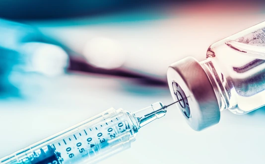 Close-up medical syringe with a vaccine.