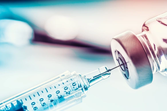 Close-up medical syringe with a vaccine.