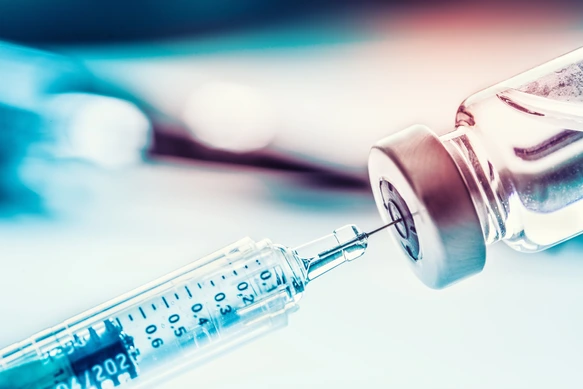 Close-up medical syringe with a vaccine.