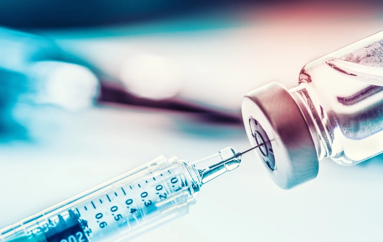 Close-up medical syringe with a vaccine.