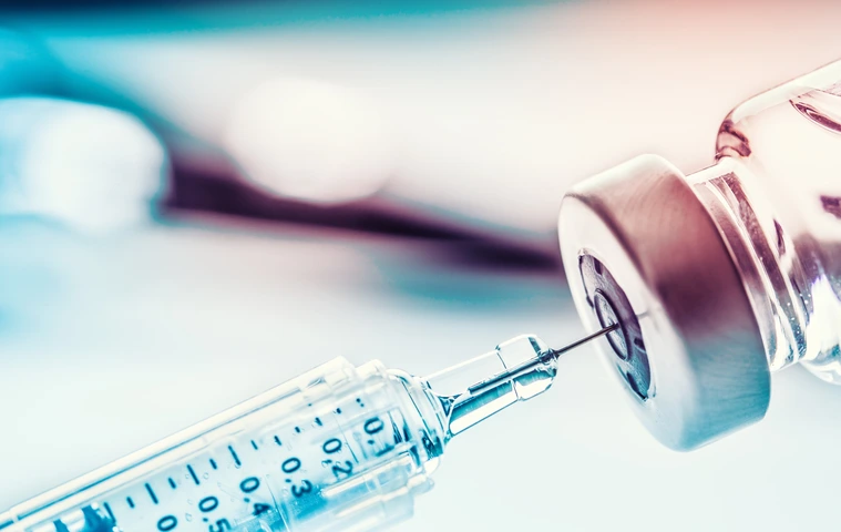 Close-up medical syringe with a vaccine.
