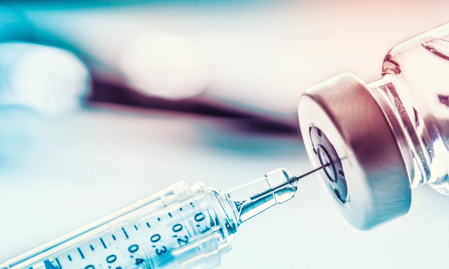 Close-up medical syringe with a vaccine.