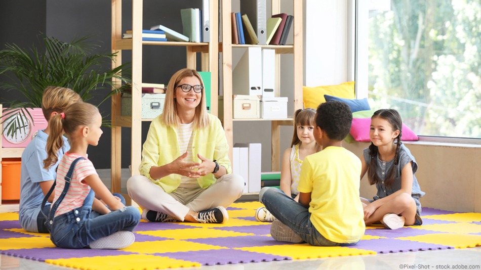 Cute children with teacher in primary school