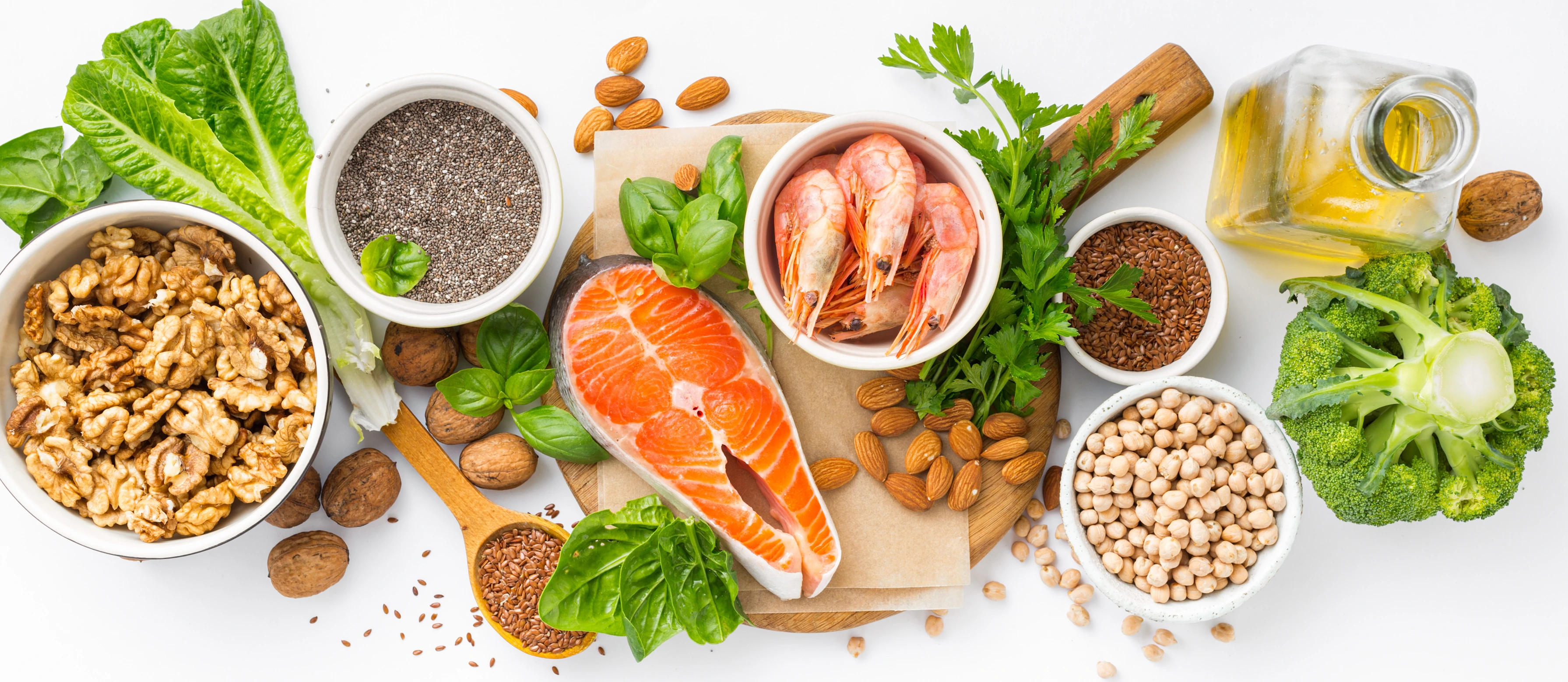 Food sources of omega 3 and omega 6 on white background top view. Foods high in fatty acids including vegetables, seafood, nut and seeds