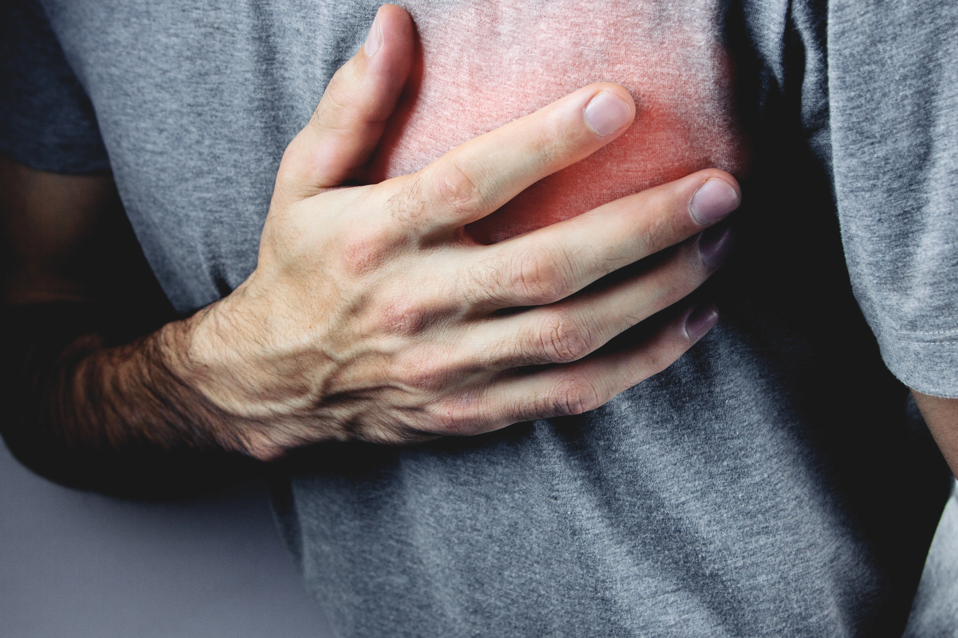 a young man has heart pains