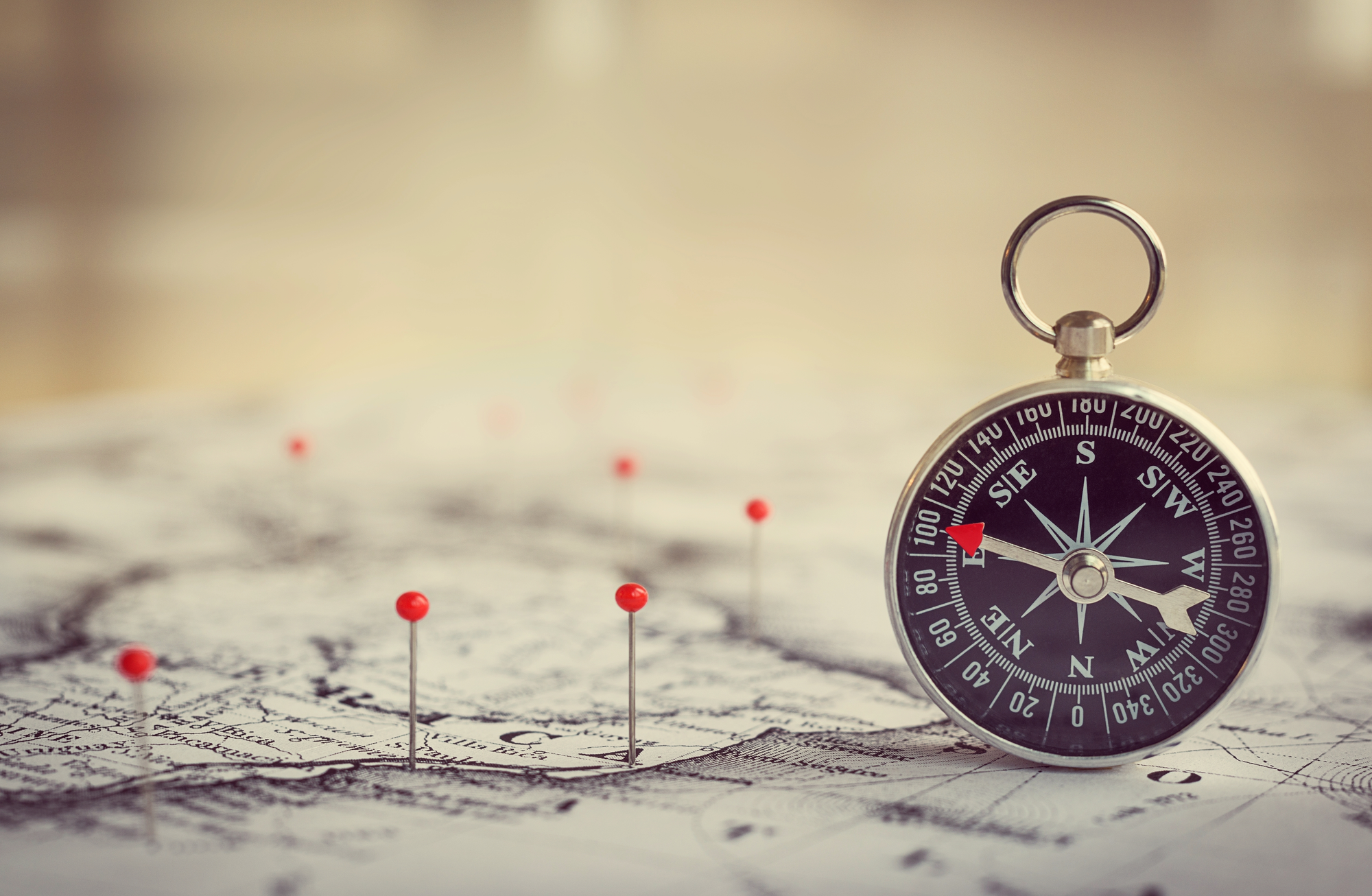Magnetic,Compass,On,A,World,Map,Conceptual,Of,Global,Travel