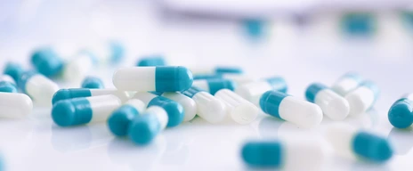Tablets scattered on the table of the pharmaceutical laboratory
