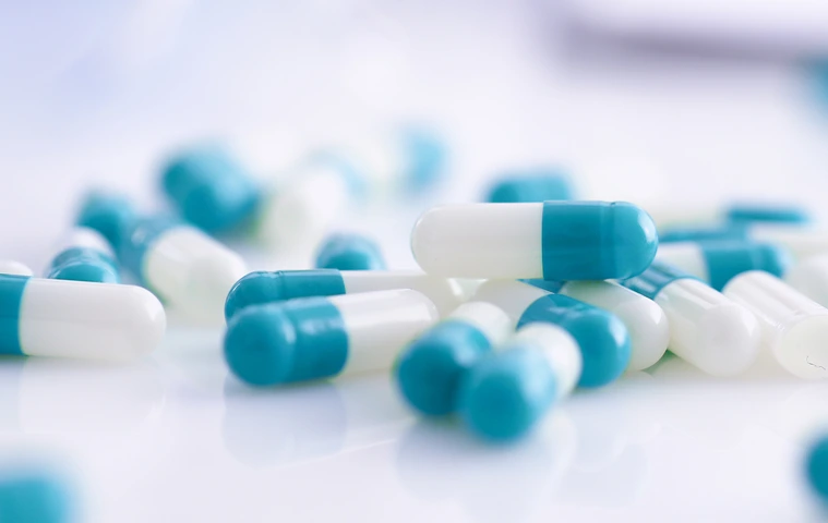 Tablets scattered on the table of the pharmaceutical laboratory