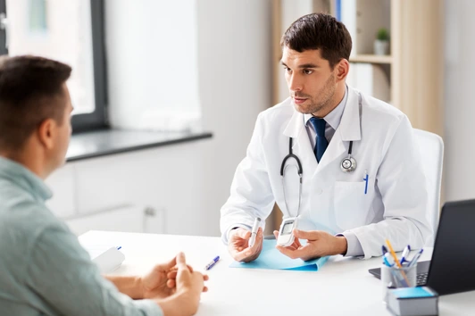 doctor with glucometer and patient at hospital