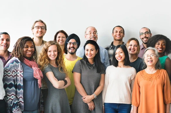  A team of diverse people doing a  group photo