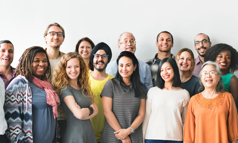 A team of diverse people doing a group photo