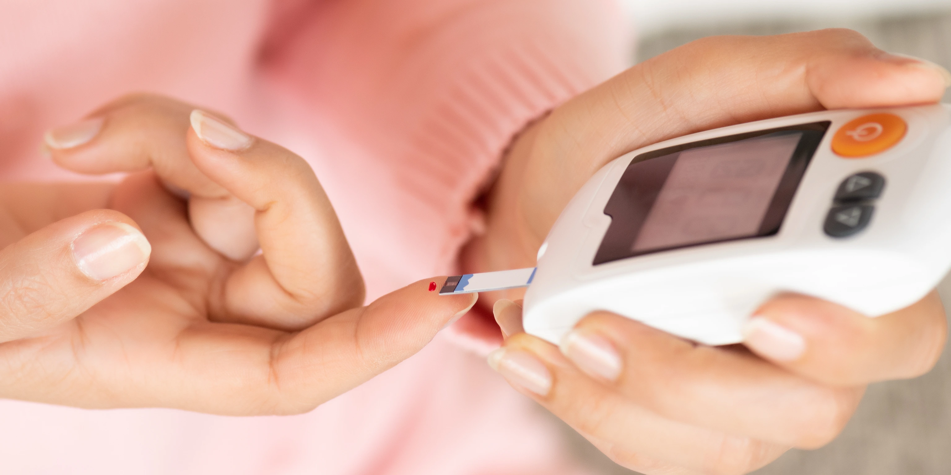 Woman checking blood sugar level