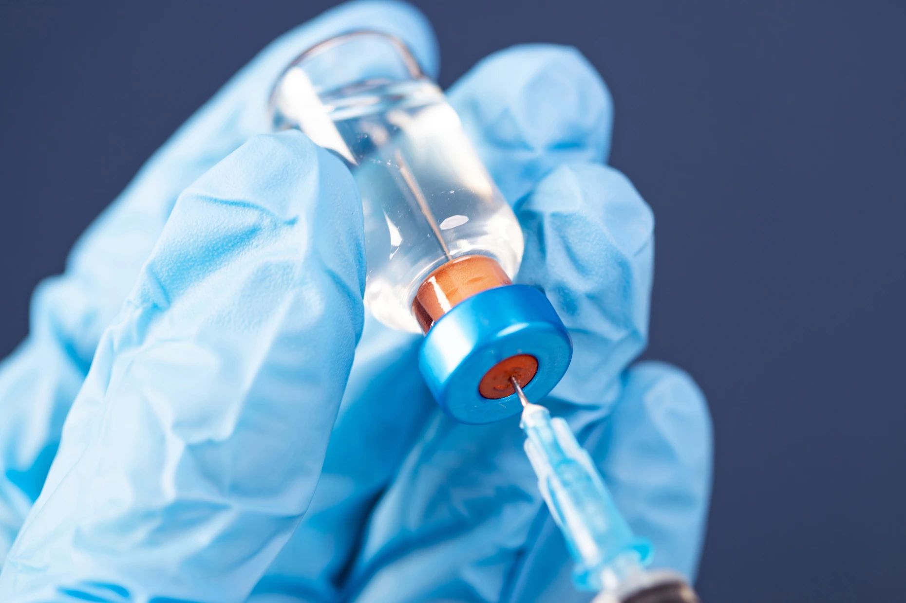 Covid-19 vaccination with vaccine bottle and syringe injection tool for coronavirus immunization treatment.