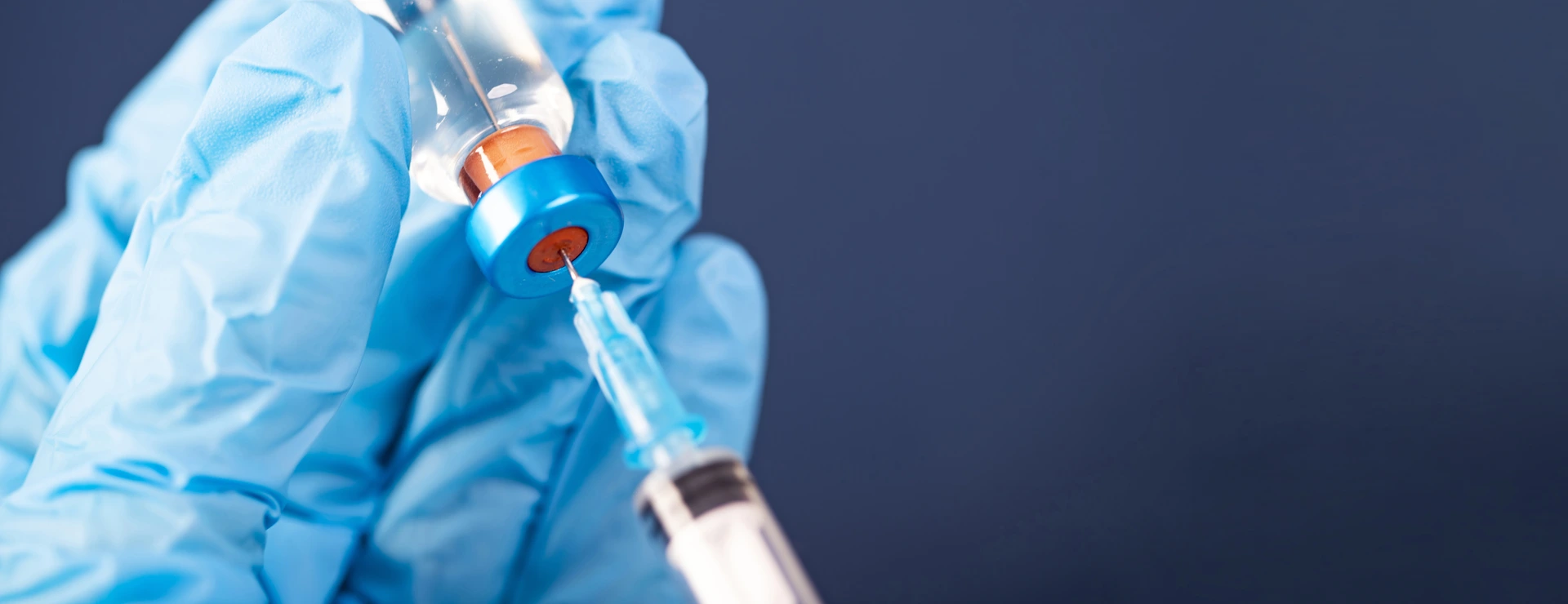 Covid-19 vaccination with vaccine bottle and syringe injection tool for coronavirus immunization treatment.