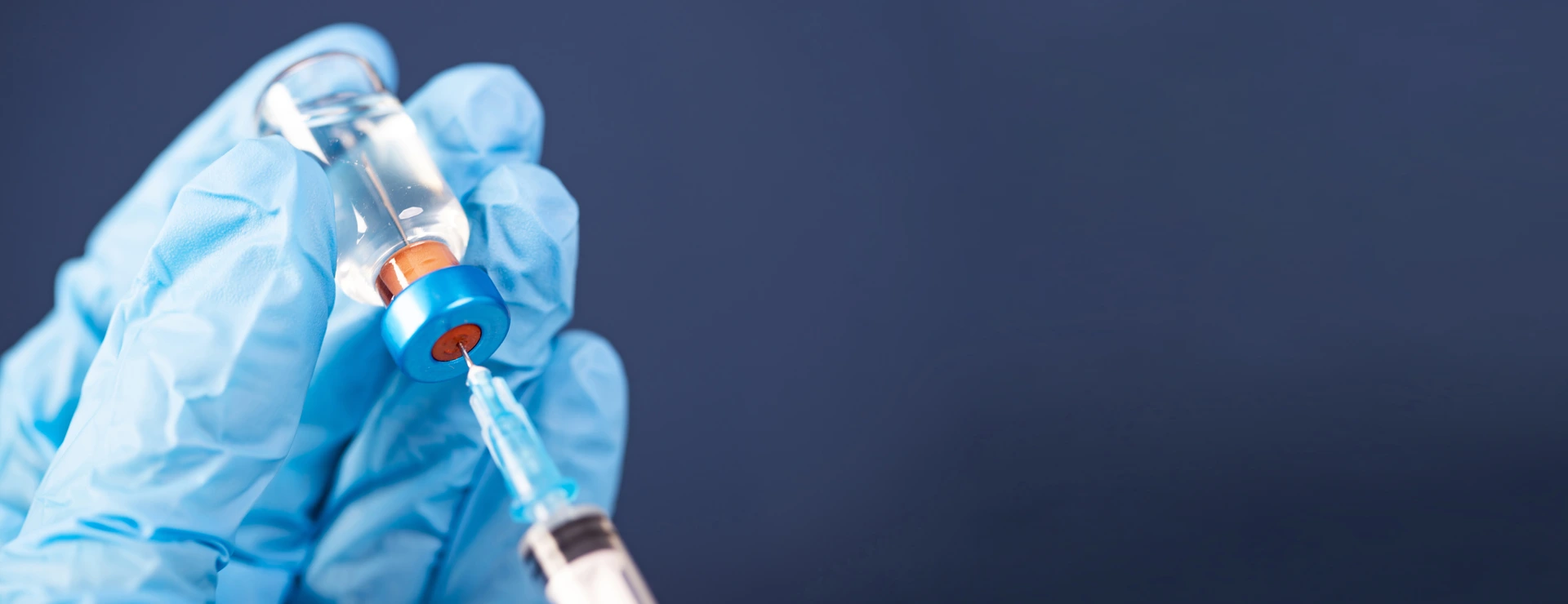 Covid-19 vaccination with vaccine bottle and syringe injection tool for coronavirus immunization treatment.
