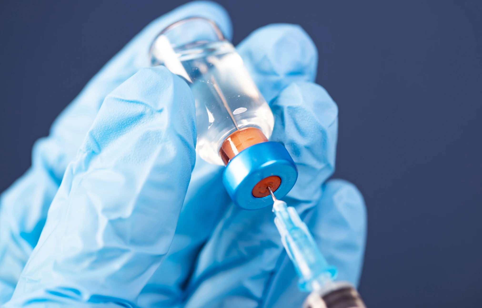 Covid-19 vaccination with vaccine bottle and syringe injection tool for coronavirus immunization treatment.