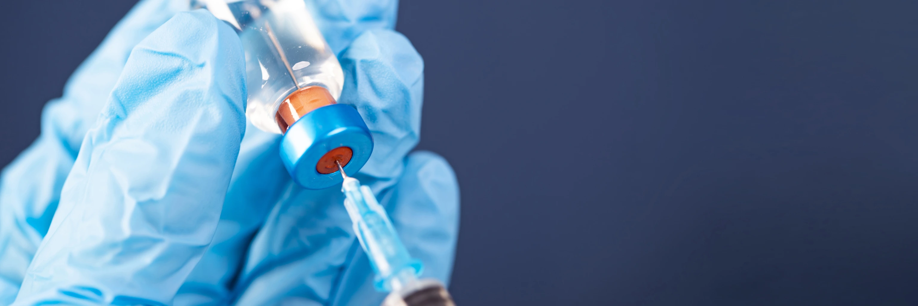 Covid-19 vaccination with vaccine bottle and syringe injection tool for coronavirus immunization treatment.