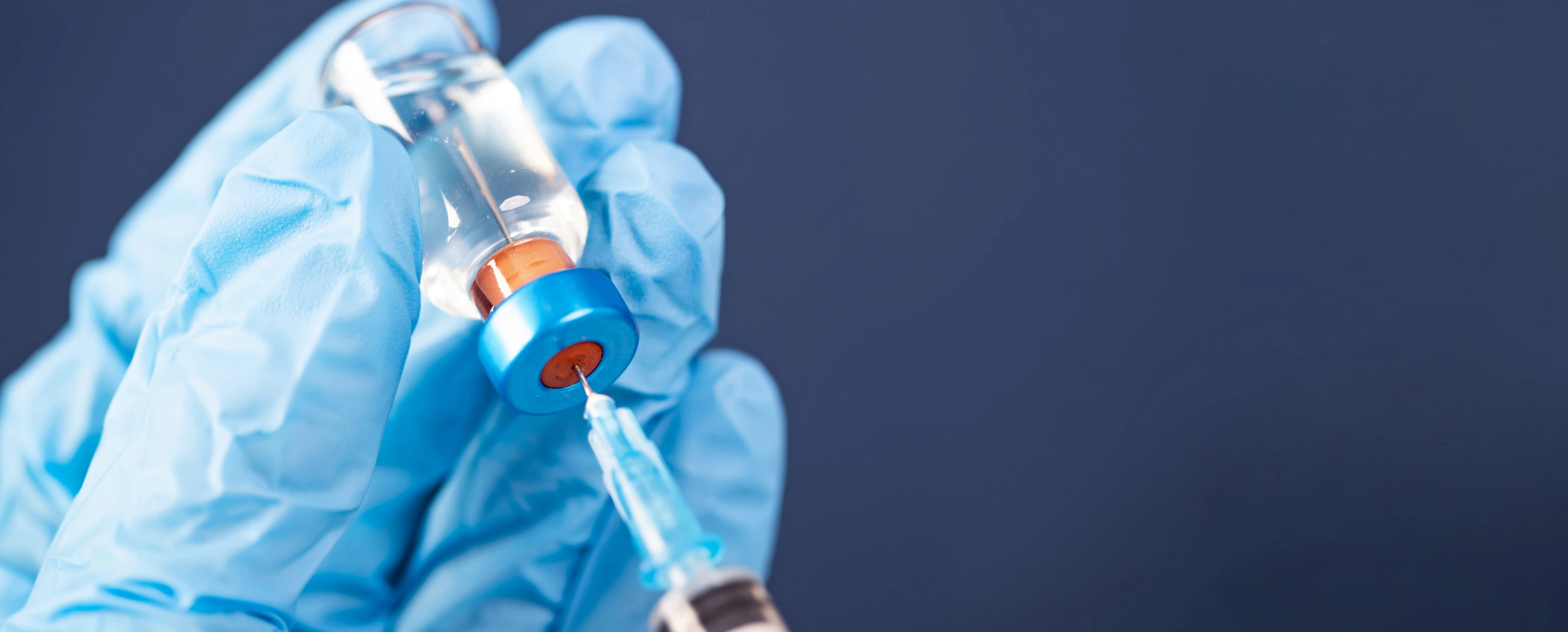 Covid-19 vaccination with vaccine bottle and syringe injection tool for coronavirus immunization treatment.