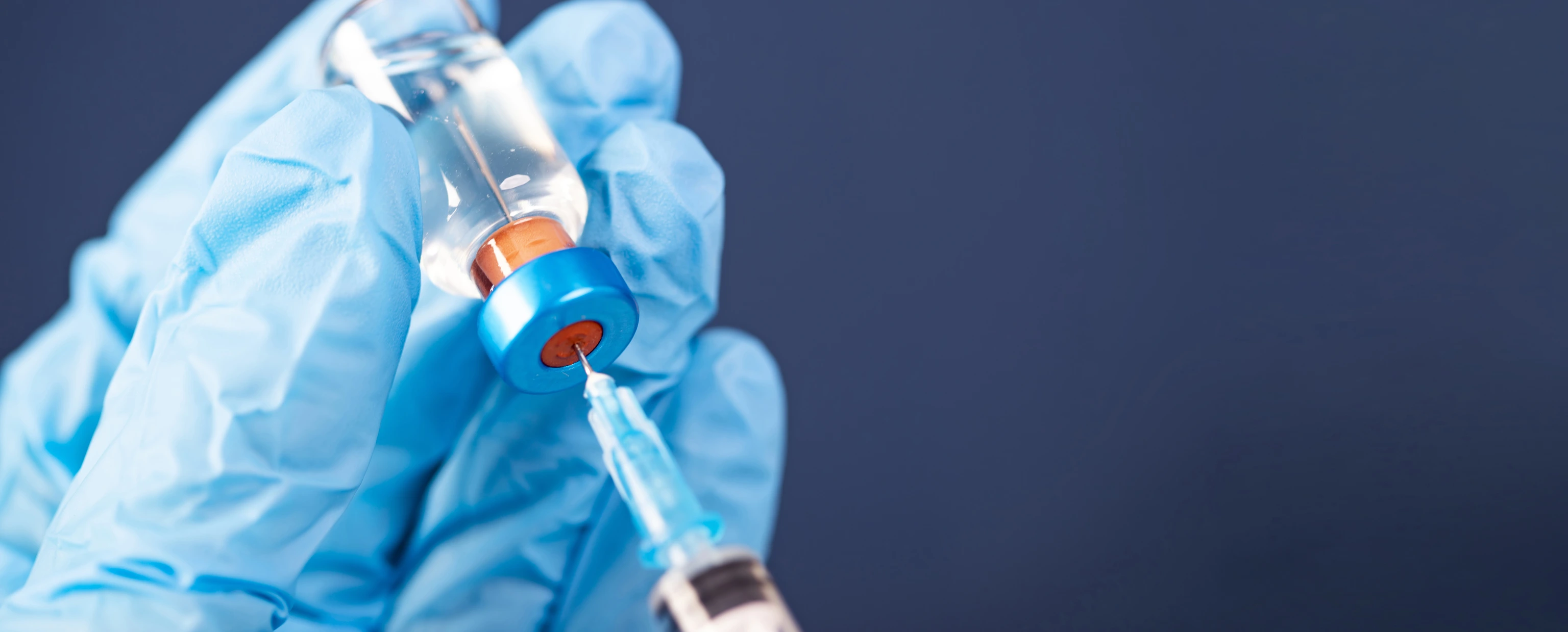 Covid-19 vaccination with vaccine bottle and syringe injection tool for coronavirus immunization treatment.