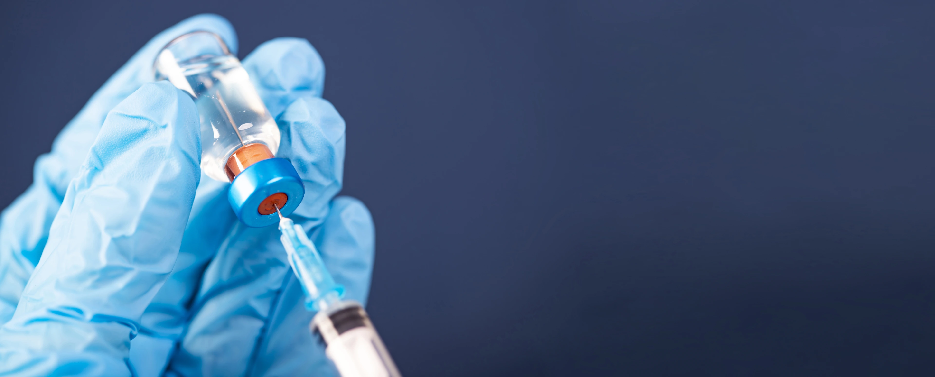 Covid-19 vaccination with vaccine bottle and syringe injection tool for coronavirus immunization treatment.