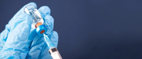 Covid-19 vaccination with vaccine bottle and syringe injection tool for coronavirus immunization treatment.