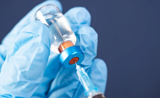 Covid-19 vaccination with vaccine bottle and syringe injection tool for coronavirus immunization treatment.