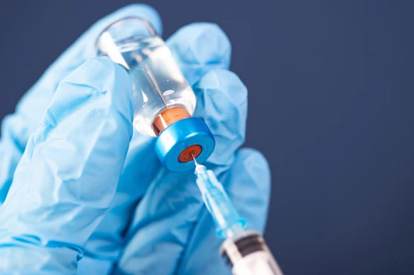 Covid-19 vaccination with vaccine bottle and syringe injection tool for coronavirus immunization treatment.