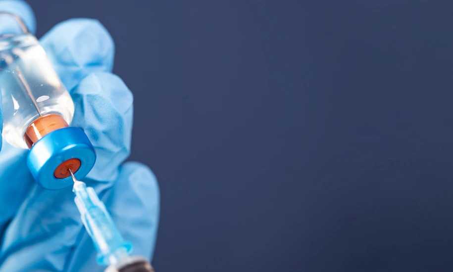 Covid-19 vaccination with vaccine bottle and syringe injection tool for coronavirus immunization treatment.