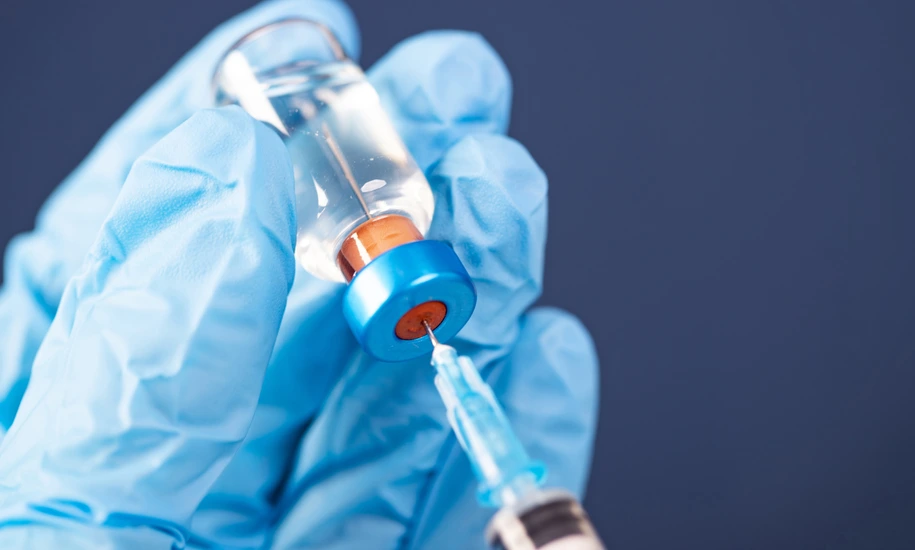 Covid-19 vaccination with vaccine bottle and syringe injection tool for coronavirus immunization treatment.
