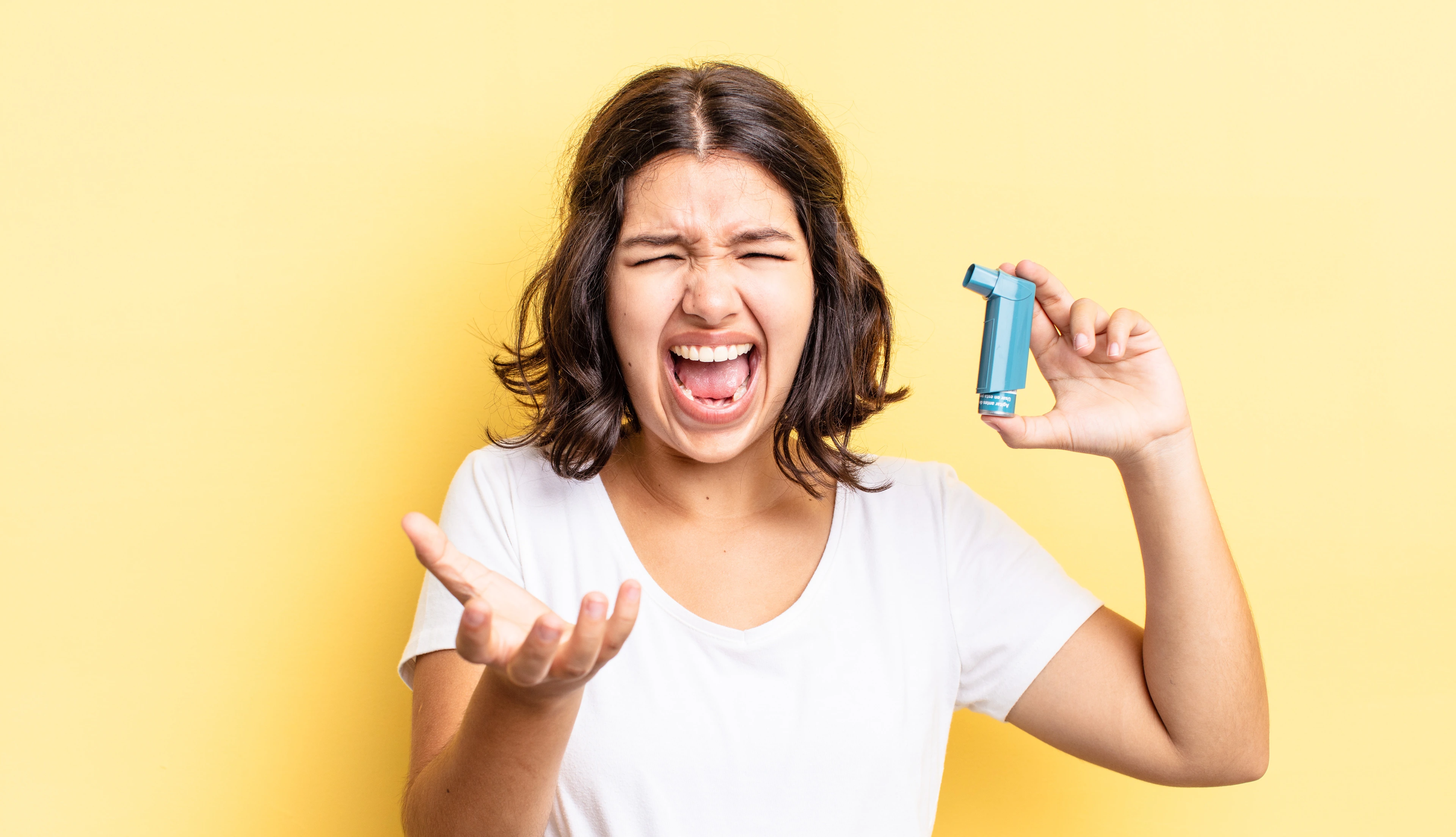 young hispanic woman looking angry, annoyed and frustrated. asthma concept