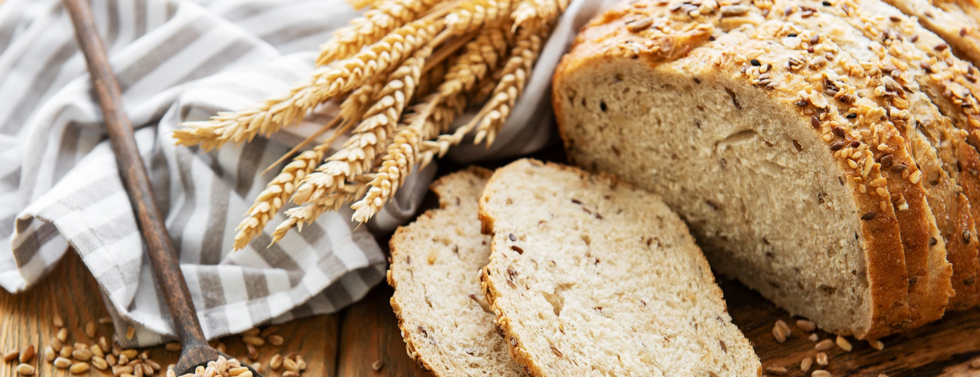 Top view of sliced wholegrain bread on a wooden table