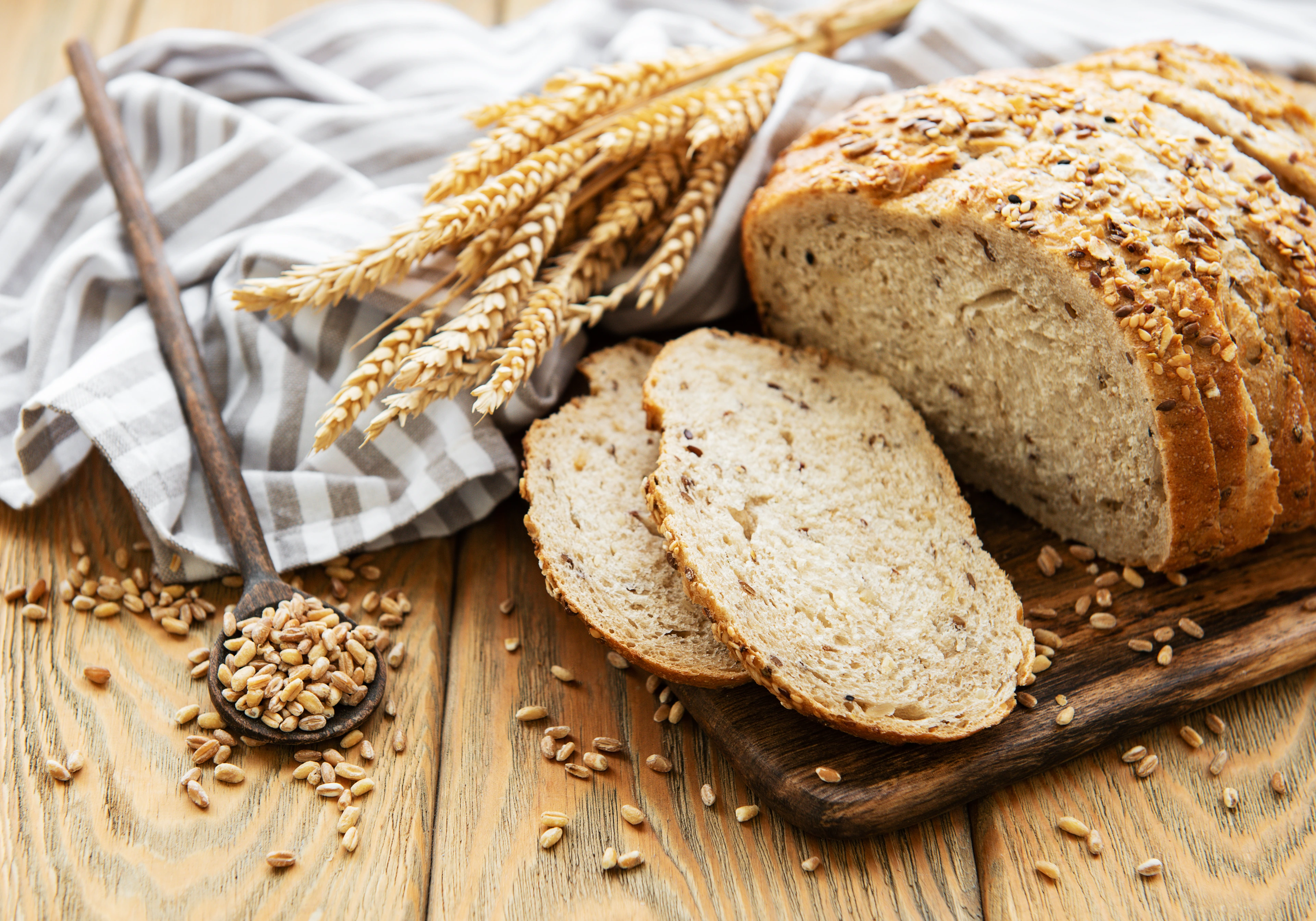 Top view of sliced wholegrain bread on a wooden table