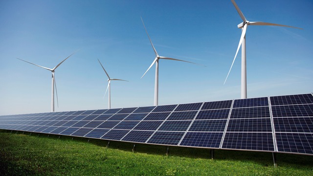 Solar Plant with wind turbines in the background