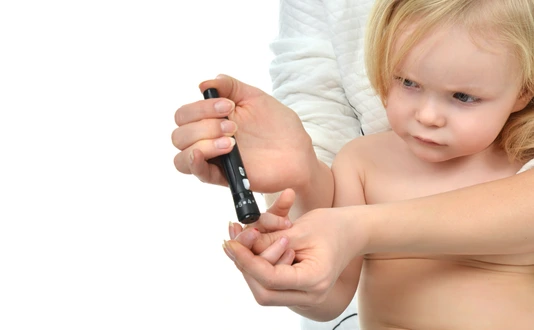Doctor prick Diabetes baby toddler finger for glucose sugar measuring