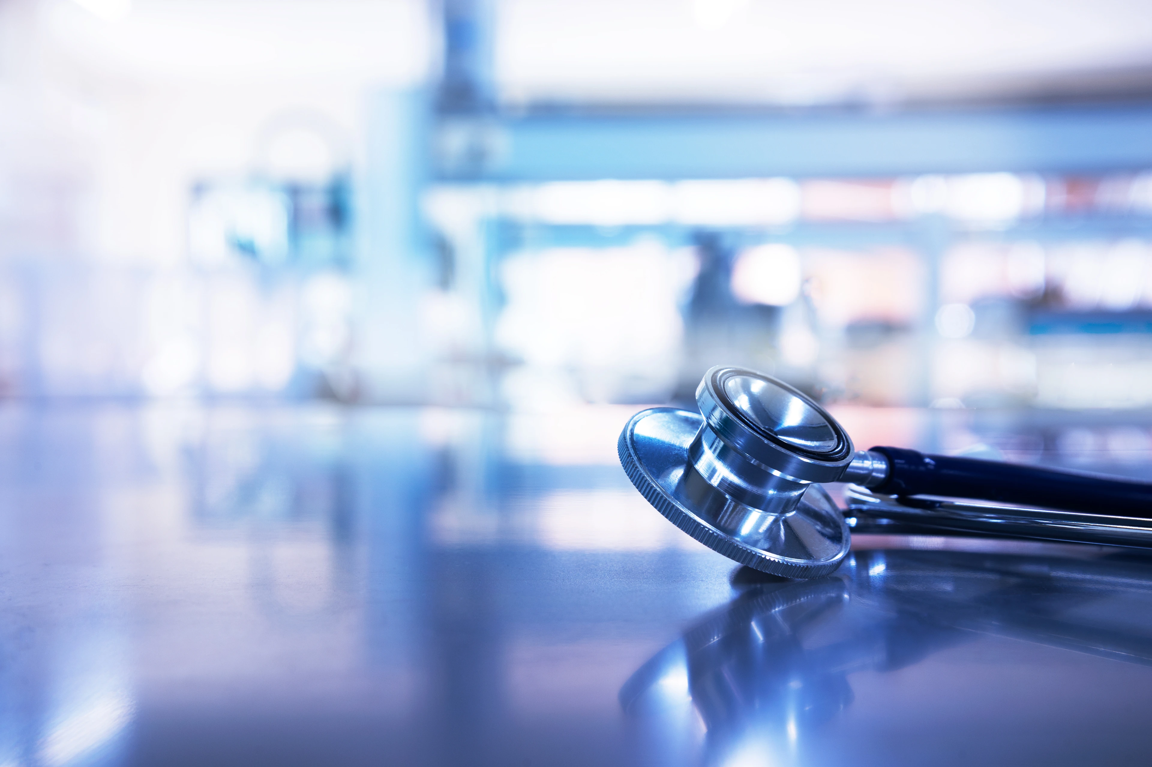 stethoscope for medical doctor diagnosis in blue science laboratory for health and insurance  background
