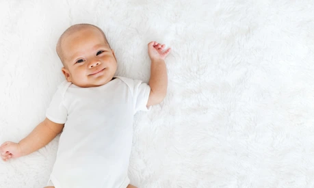 Portrait newborn baby happy over white background, topview