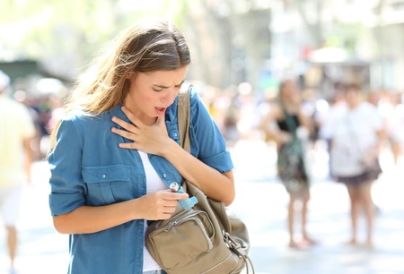 Asthmatic girl suffering an attack