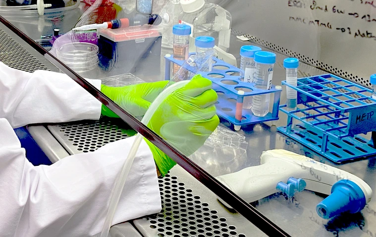 Researcher working under sterile bench